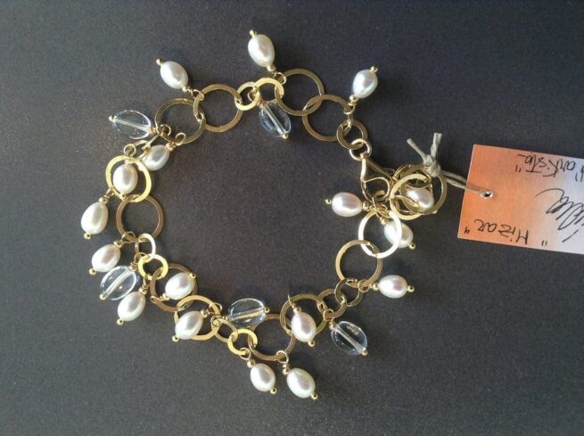 bracciale argento dorato perle regolabile nome Mizar sfondo nero foto principale