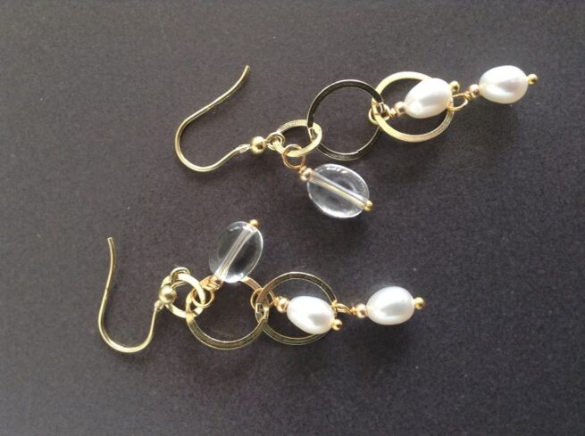 orecchini argento dorato perle nome Mizar orizzontali sfondo nero